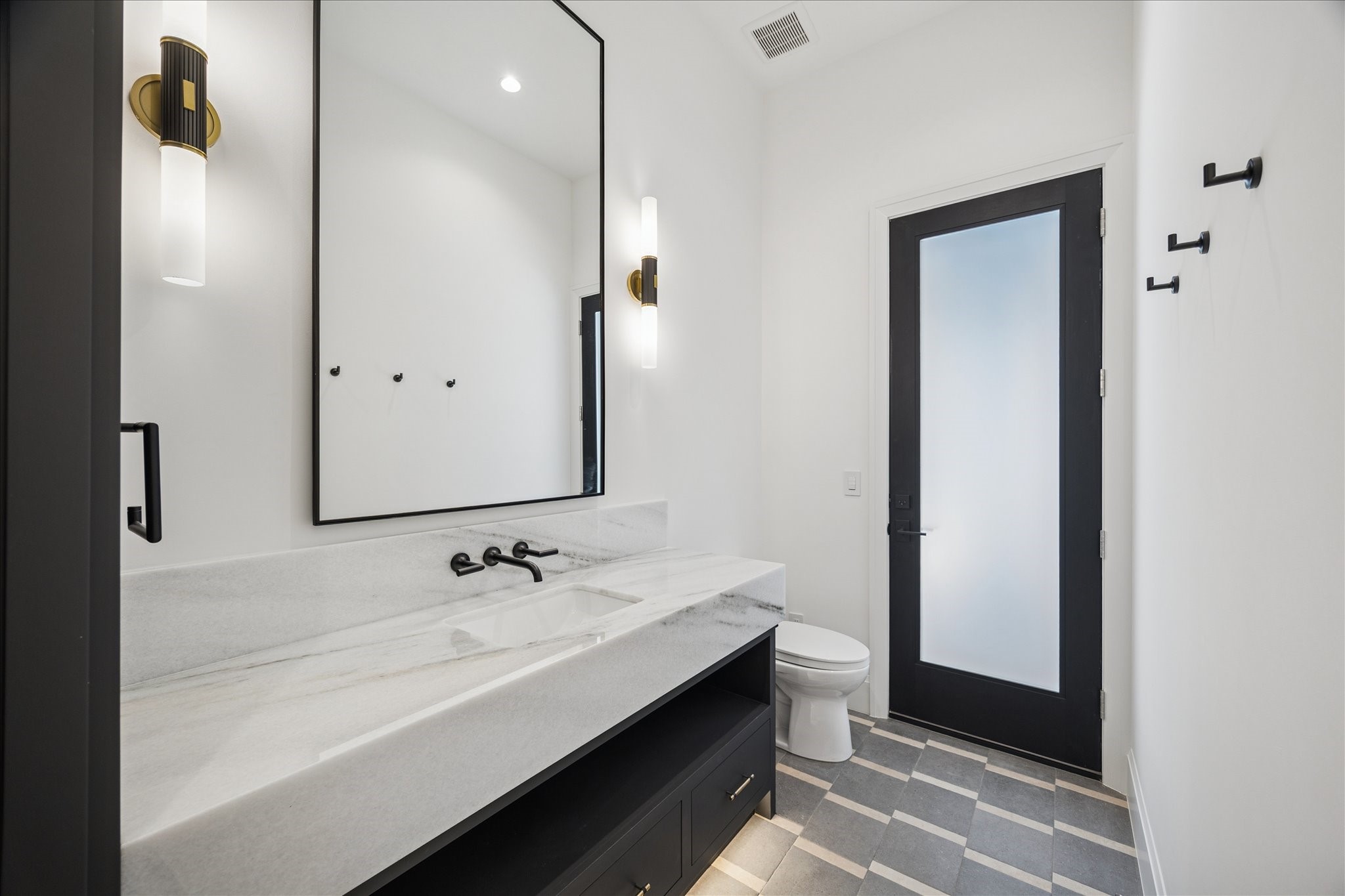 267 Maple Valley Road Houston, TX 77056 - Photo 17 of 40 a bathroom with a double vanity sink and mirror