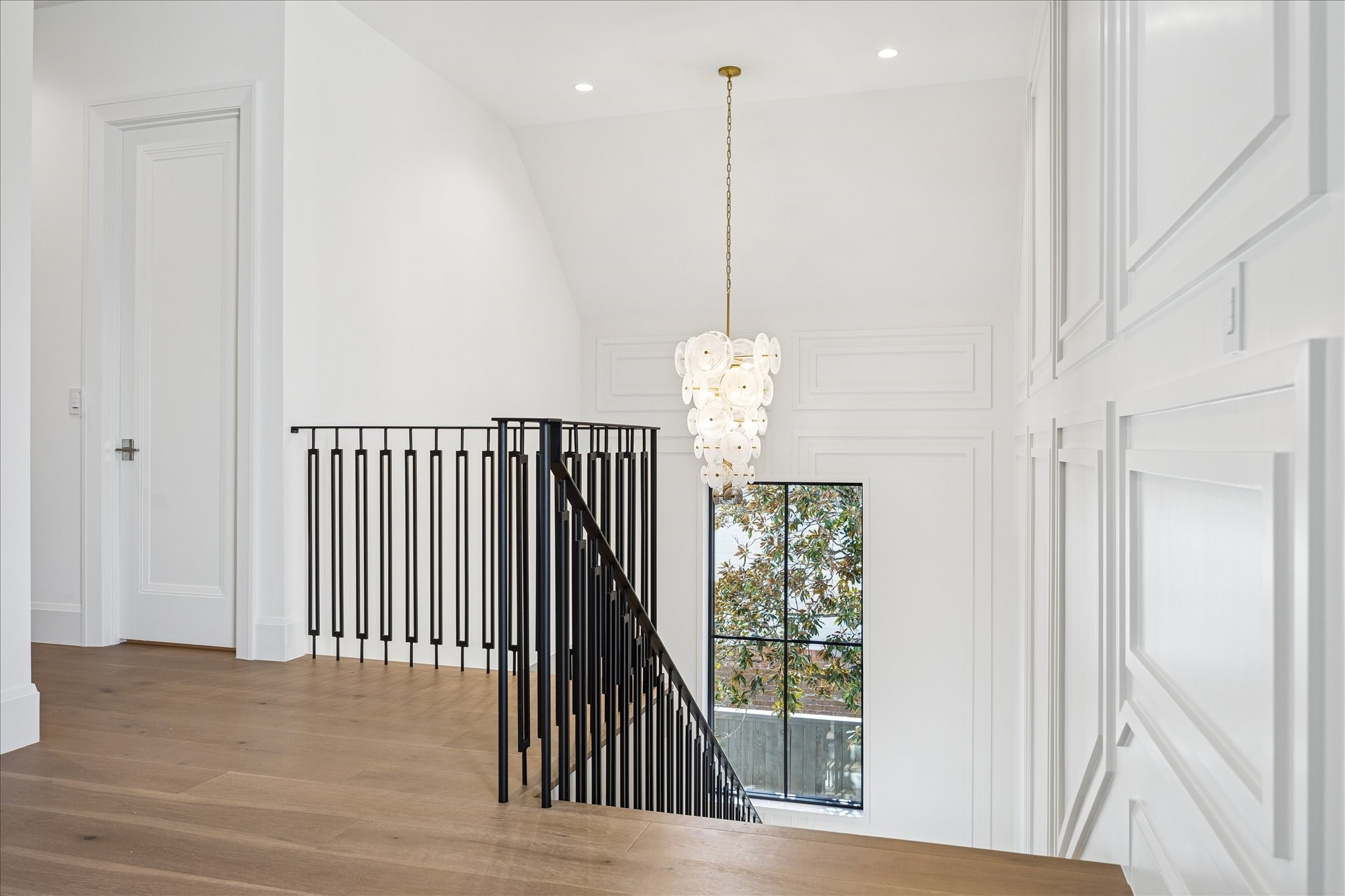 267 Maple Valley Road Houston, TX 77056 - Photo 20 of 40 a view of a hallway with windows and chandelier