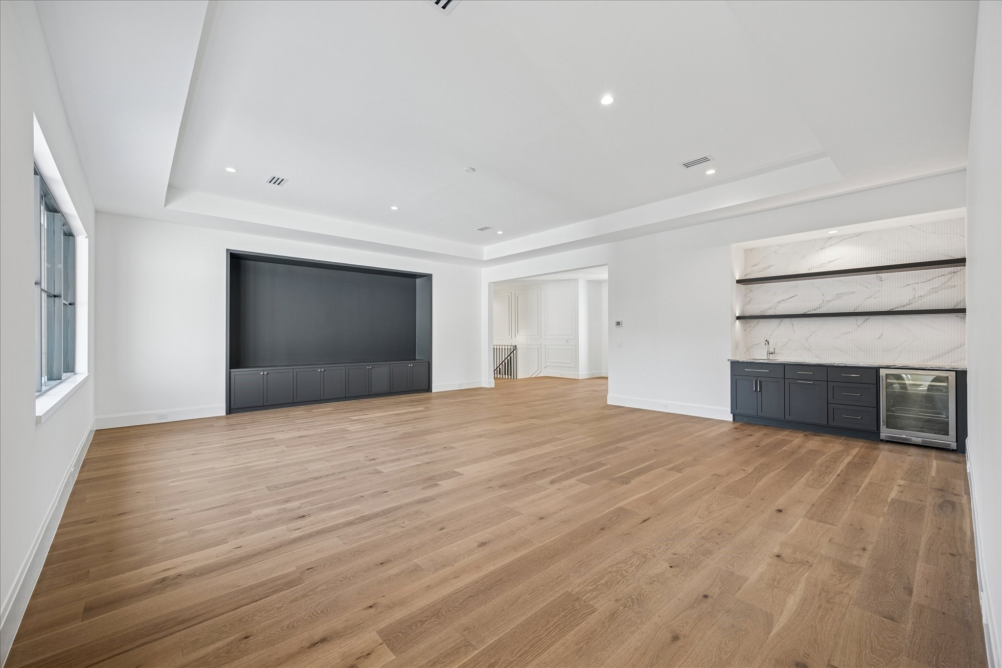 267 Maple Valley Road Houston, TX 77056 - Photo 21 of 40 a view of empty room with wooden floor and fireplace