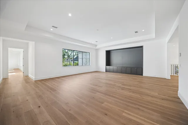a bathroom with a double vanity sink toilet mirror and shower