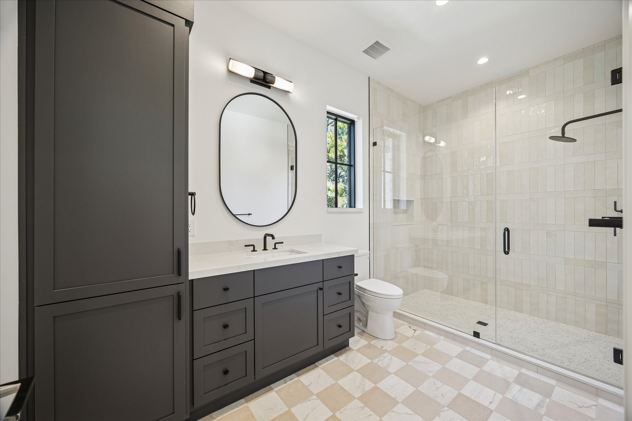 267 Maple Valley Road Houston, TX 77056 - Photo 30 of 40 a bathroom with a double vanity sink toilet mirror and shower