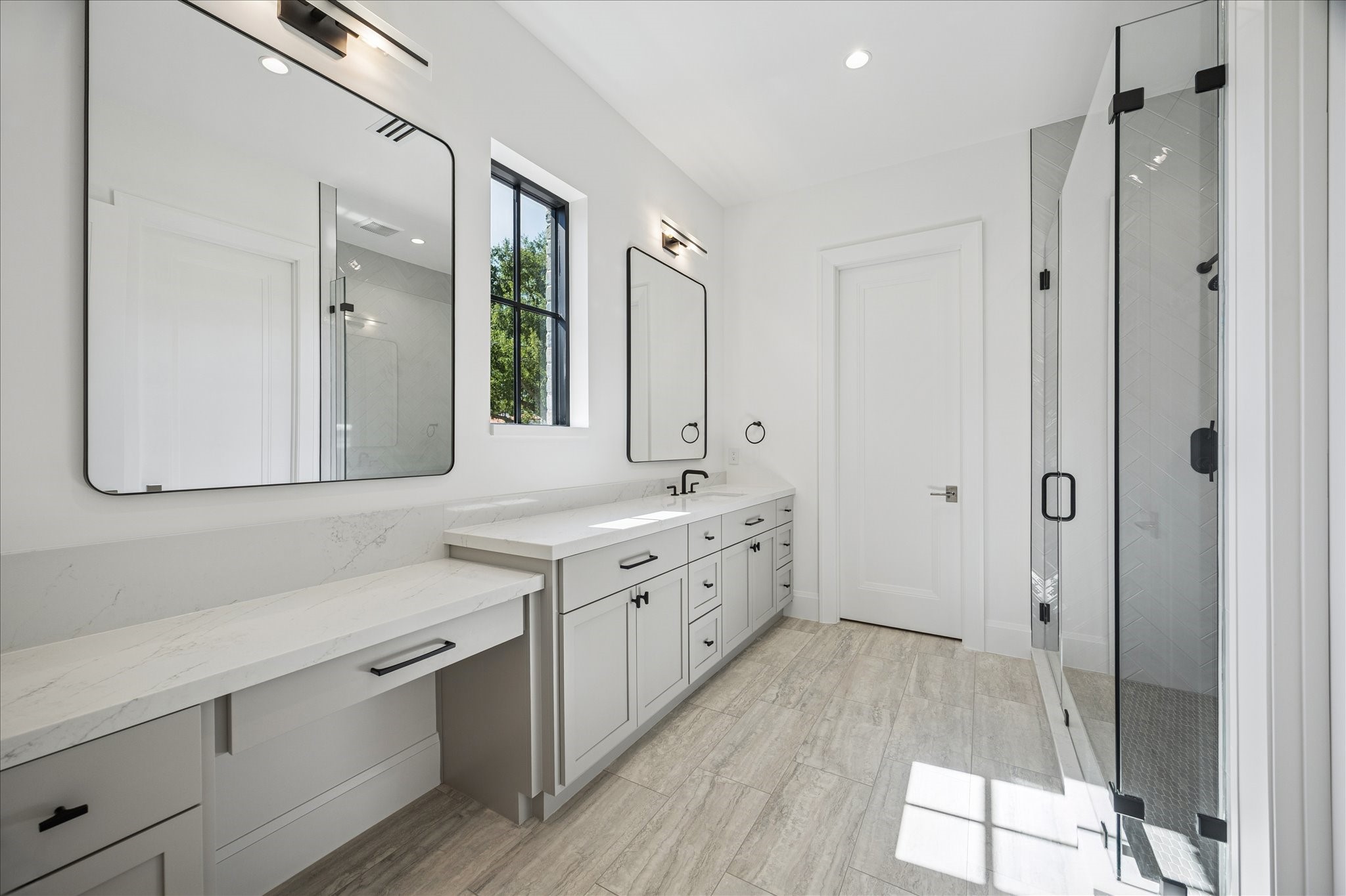 267 Maple Valley Road Houston, TX 77056 - Photo 34 of 40 a spacious bathroom with a double vanity sink a mirror and a shower