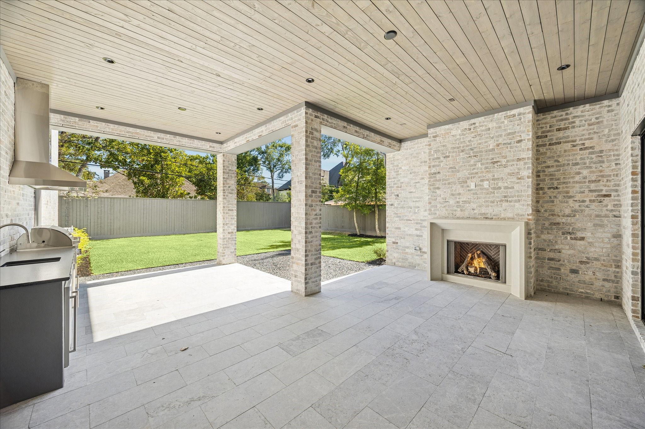 267 Maple Valley Road Houston, TX 77056 - Photo 36 of 40 a view of an empty room with a fireplace and a window