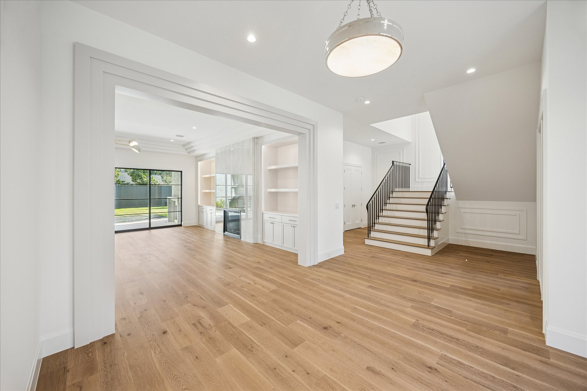 267 Maple Valley Road Houston, TX 77056 - Photo 4 of 40 a view of an empty room with wooden floor and a window