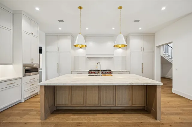 a kitchen with a stove and a sink