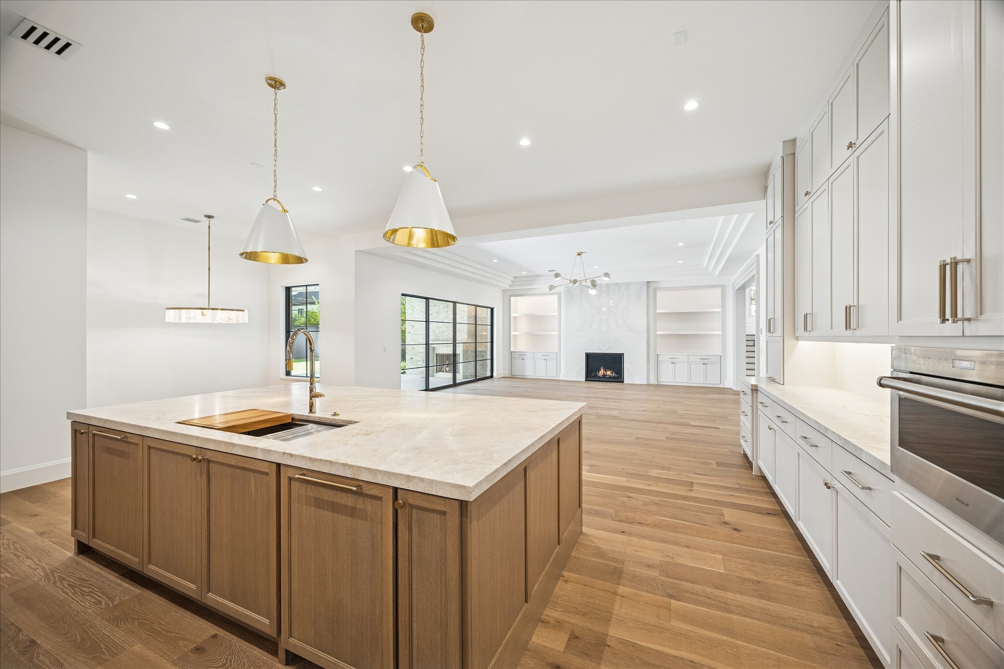 267 Maple Valley Road Houston, TX 77056 - Photo 9 of 40 a kitchen with stainless steel appliances granite countertop a sink a stove and a wooden floors