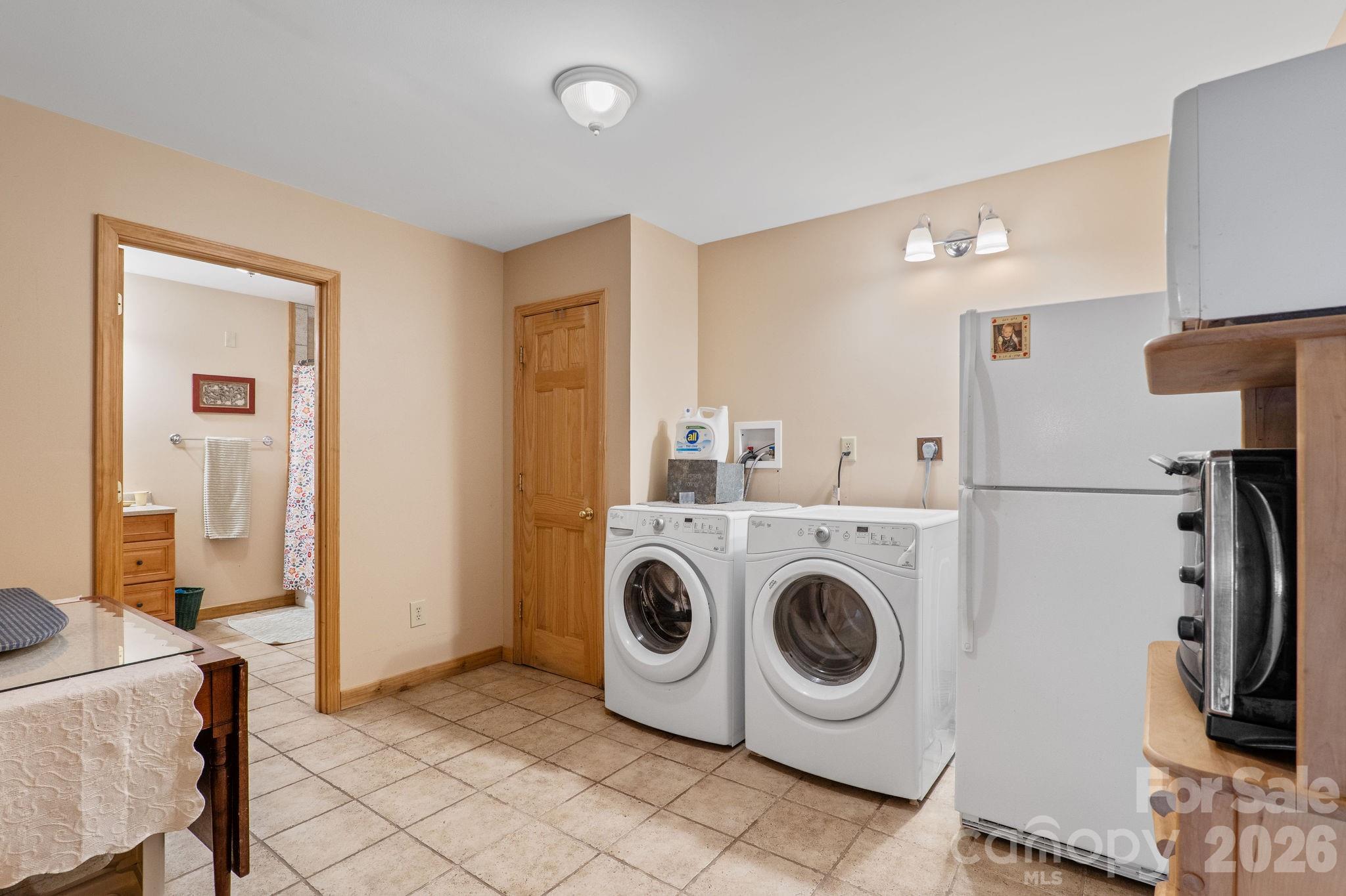 150 Avondale Ridge Road Asheville, NC 28803 - Photo 37 of 45 a utility room with dryer and washer