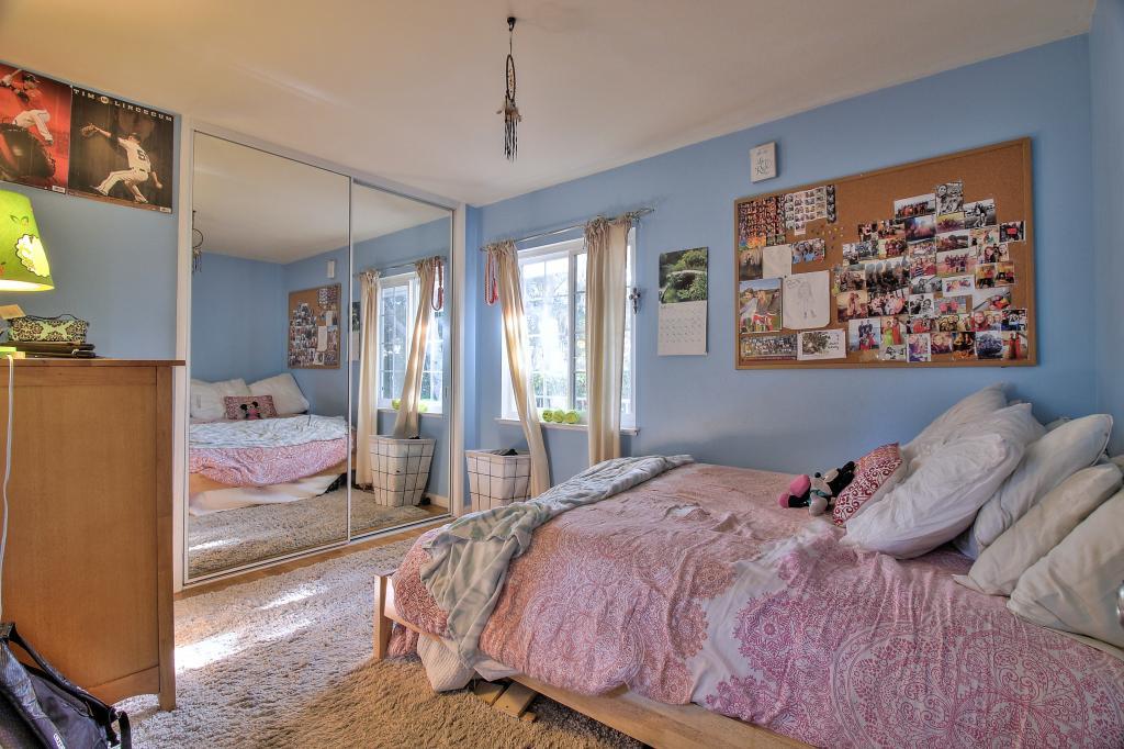 3112 Sloat Road Pebble Beach, CA 93953 - Photo 11 of 26 a bedroom with a large bed and a painting on the wall