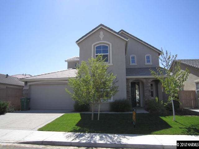 2540 Country Falls Lane Reno, NV 89521 - Photo 1 of 13 a front view of a house with a garden