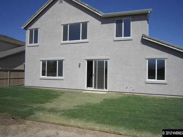 2540 Country Falls Lane Reno, NV 89521 - Photo 13 of 13 a house that has a big yard in front of it