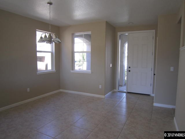 2540 Country Falls Lane Reno, NV 89521 - Photo 4 of 13 a view of an empty room with window and closet area