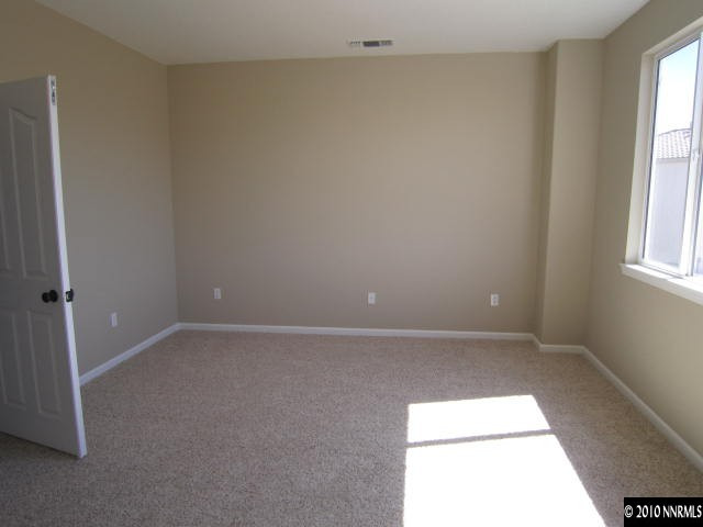2540 Country Falls Lane Reno, NV 89521 - Photo 5 of 13 an empty room with windows