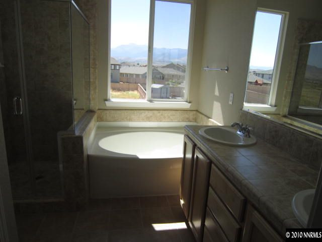 2540 Country Falls Lane Reno, NV 89521 - Photo 6 of 13 a bathroom with a sink and a bathtub