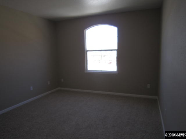 2540 Country Falls Lane Reno, NV 89521 - Photo 7 of 13 an empty room with a window