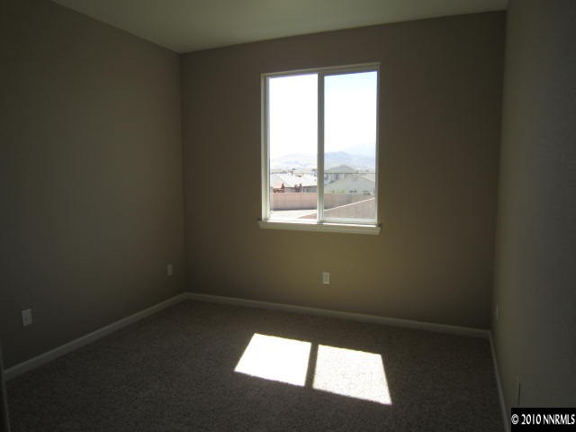 2540 Country Falls Lane Reno, NV 89521 - Photo 9 of 13 a view of an empty room with a window