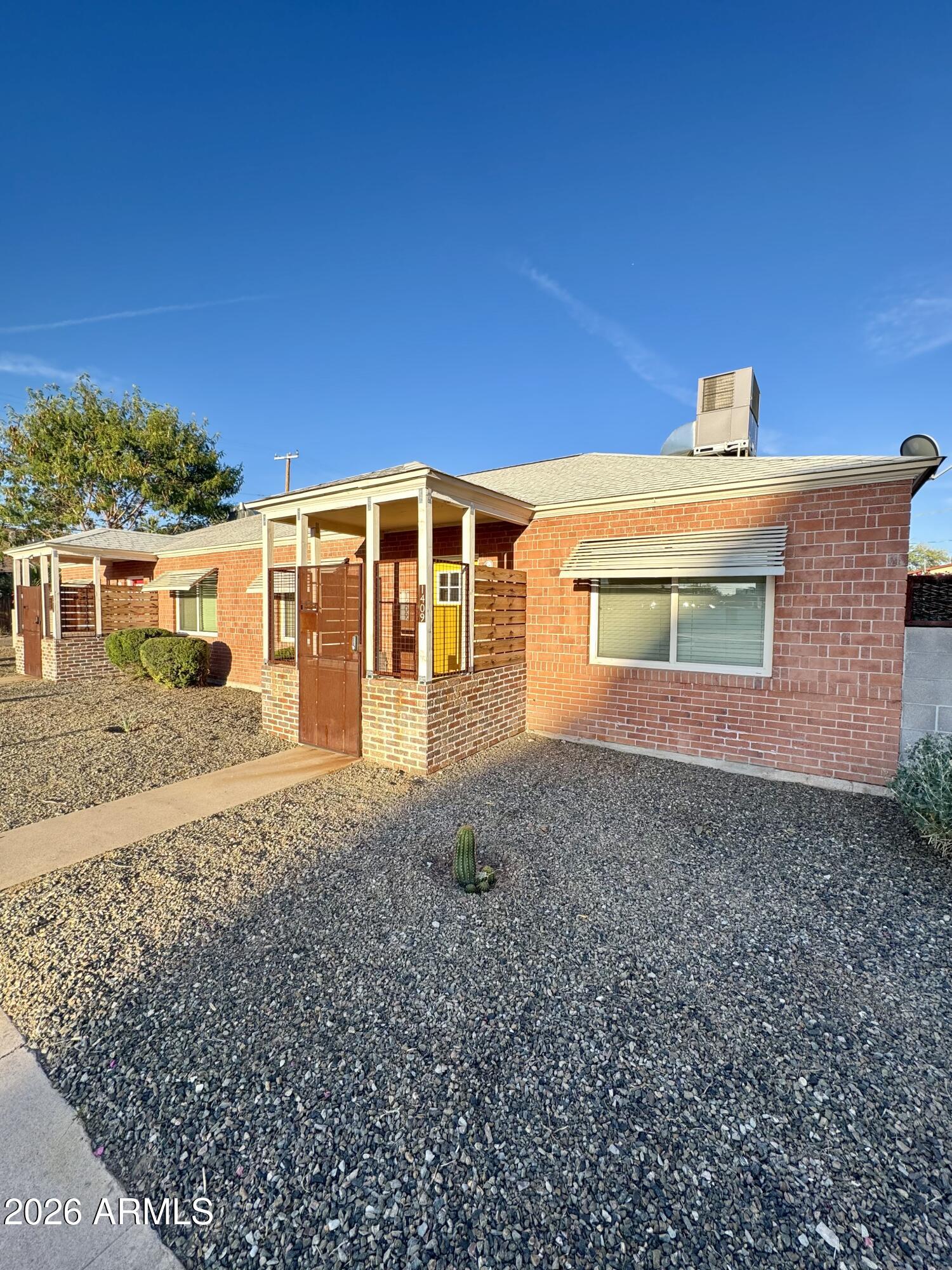 1409 North 5th Street Phoenix, AZ 85004 - Photo 1 of 9 a front view of a house with a yard