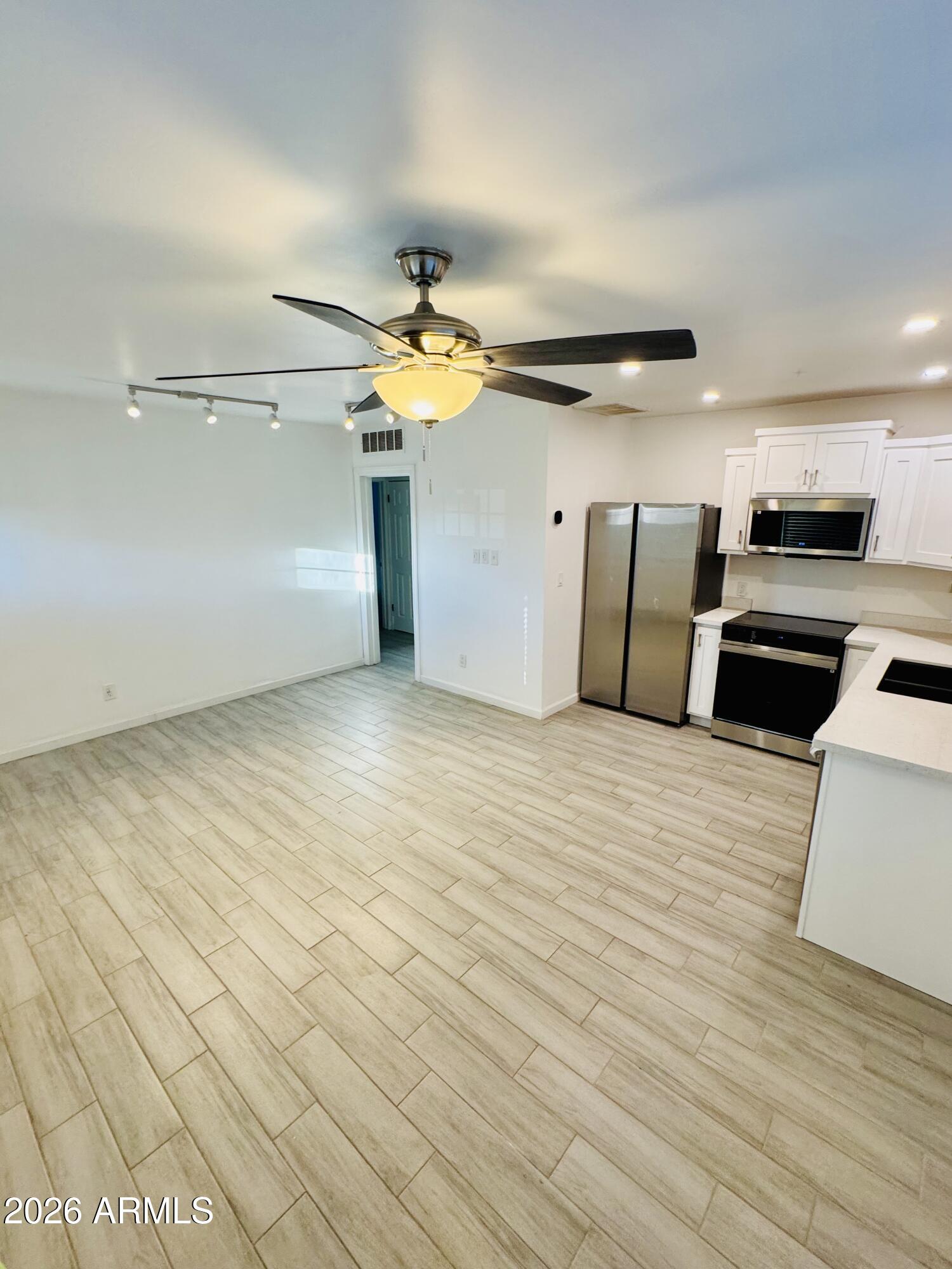1409 North 5th Street Phoenix, AZ 85004 - Photo 2 of 9 a view of a livingroom with kitchen and furniture