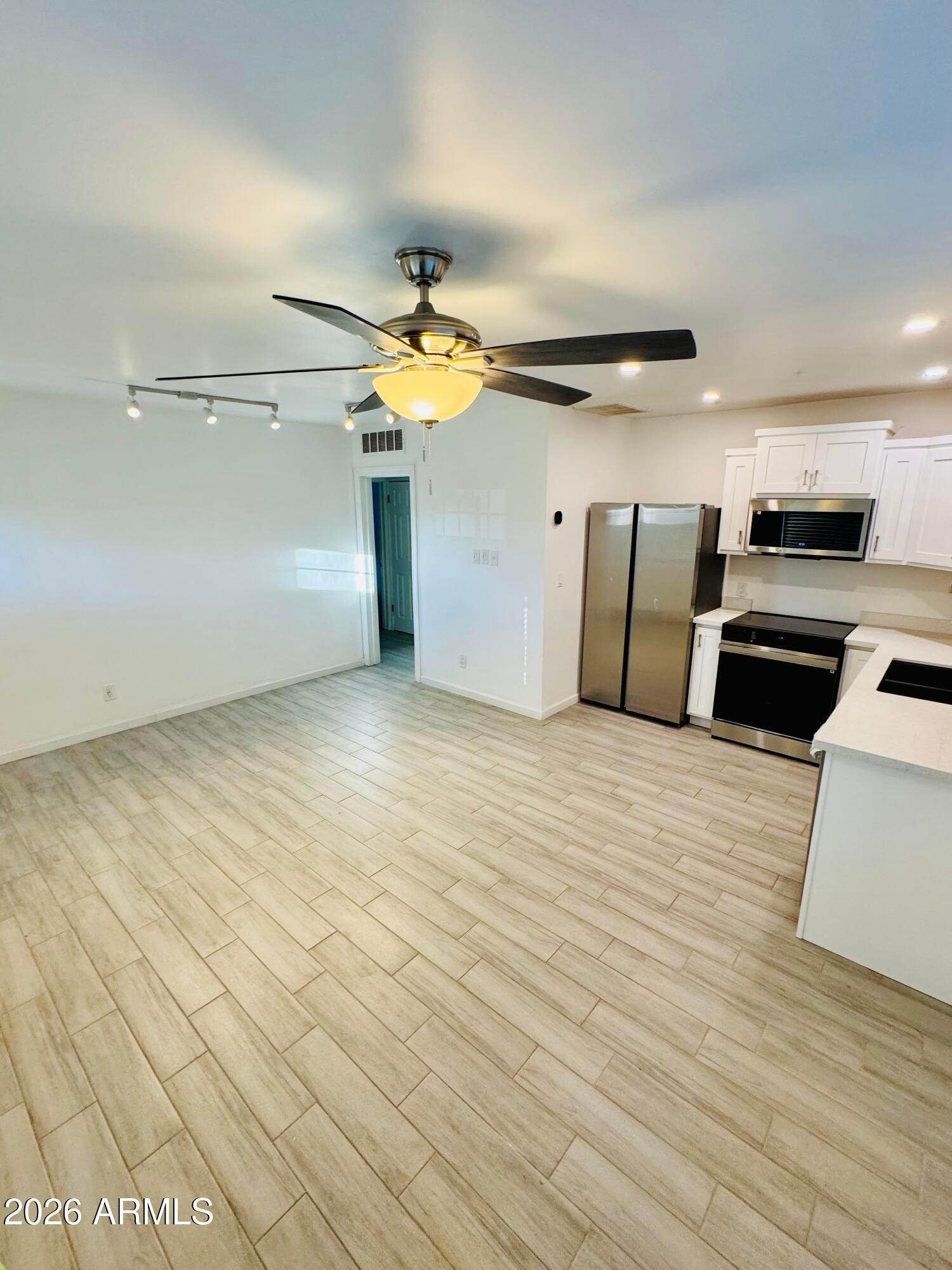 1409 North 5th Street Phoenix, AZ 85004 - Photo 2 of 9 a view of a livingroom with kitchen and furniture