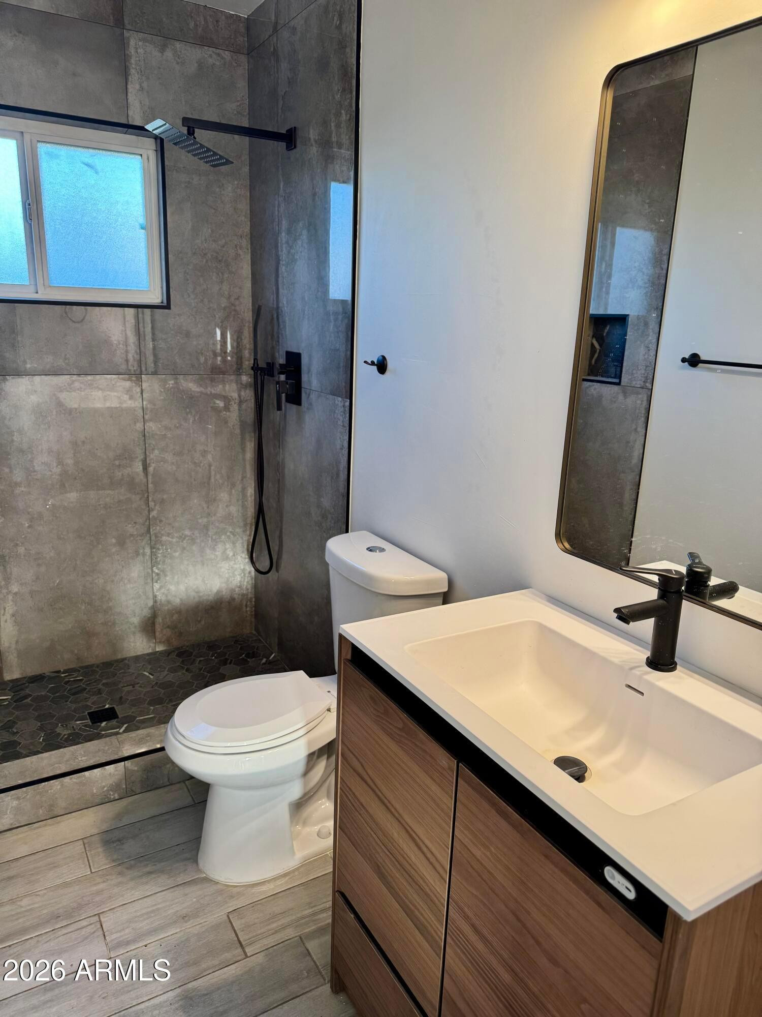 1409 North 5th Street Phoenix, AZ 85004 - Photo 5 of 9 a bathroom with a sink toilet and shower
