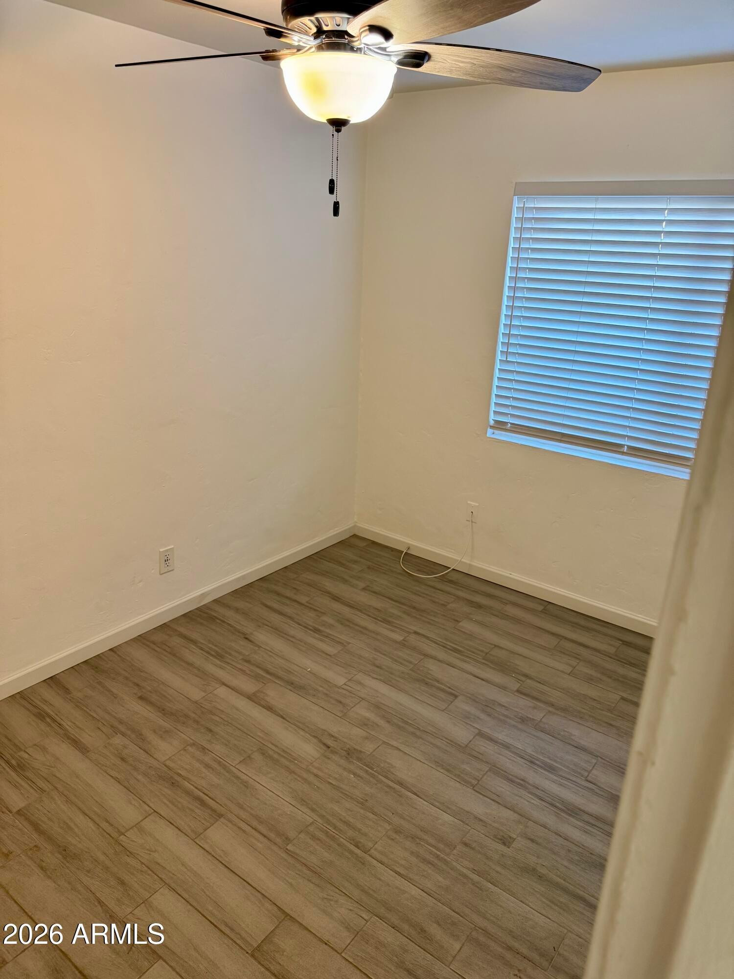 1409 North 5th Street Phoenix, AZ 85004 - Photo 6 of 9 a view of a room with wooden floor