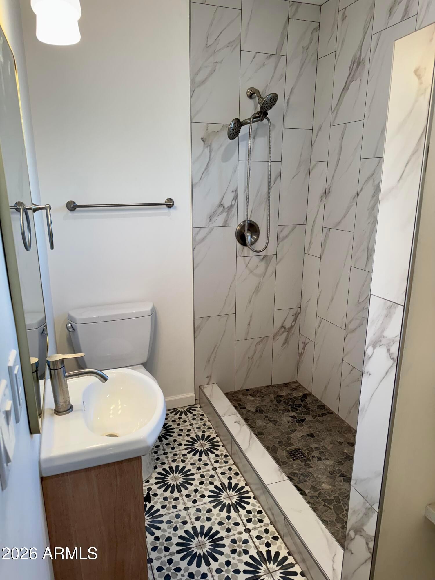 1409 North 5th Street Phoenix, AZ 85004 - Photo 7 of 9 a bathroom with a sink toilet and shower