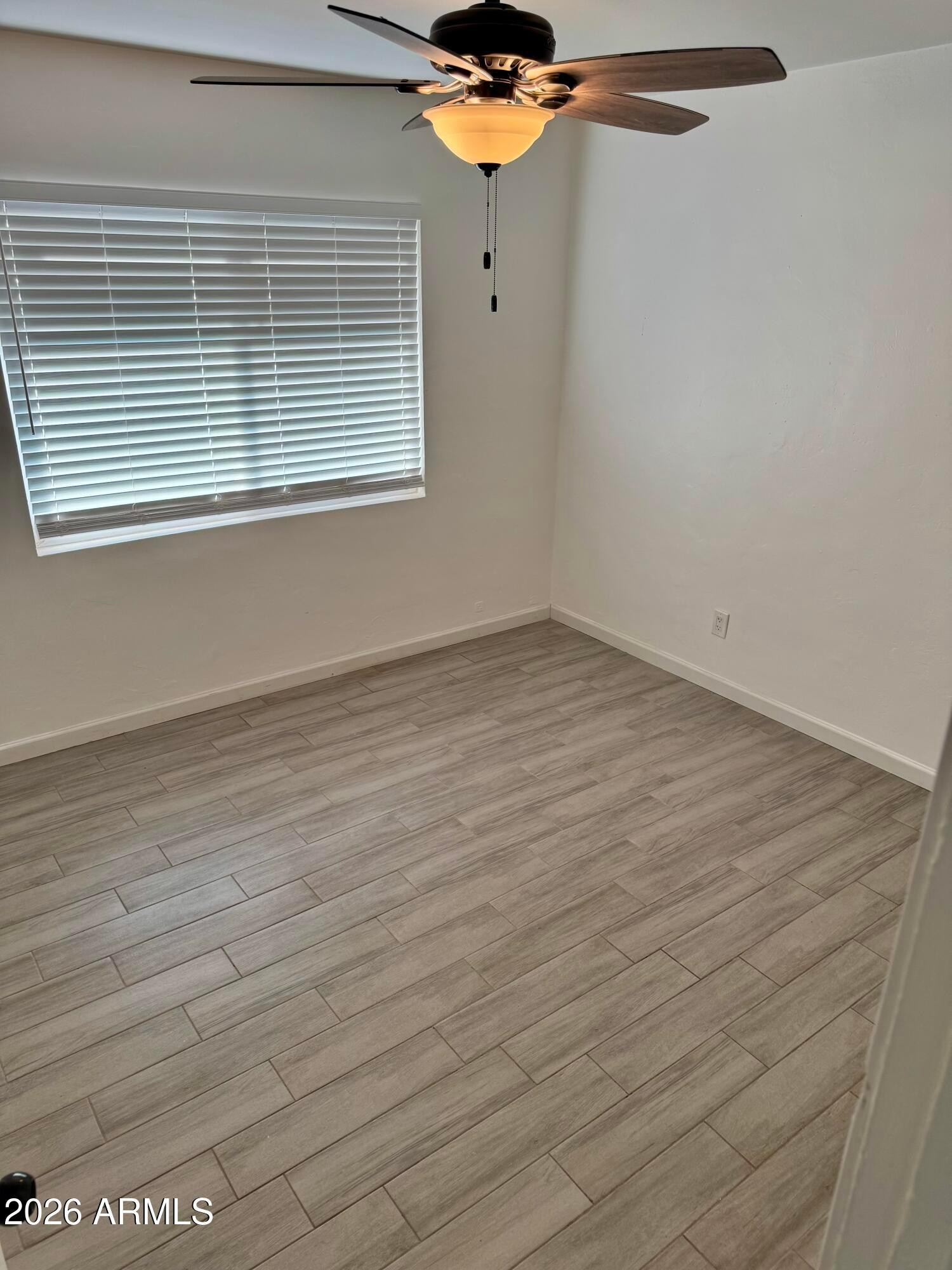 1409 North 5th Street Phoenix, AZ 85004 - Photo 8 of 9 a view of a room with wooden floor and fan