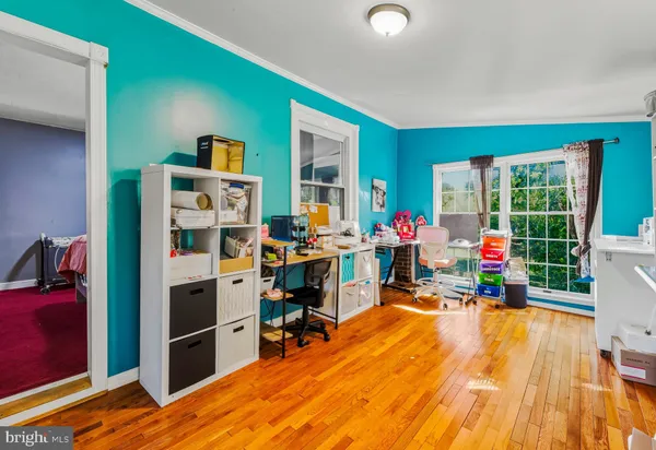 a room with furniture and a wooden floor