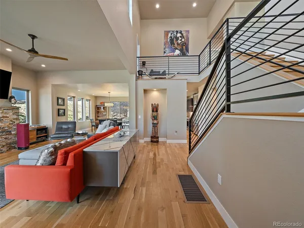 a view of a living room with furniture and a fireplace