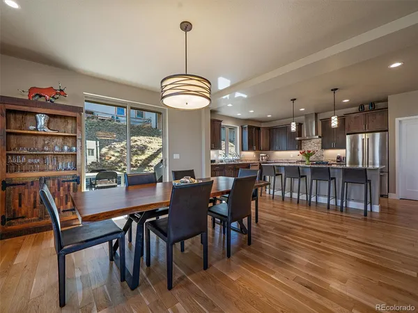 a view of a dining room with furniture window and wooden floor