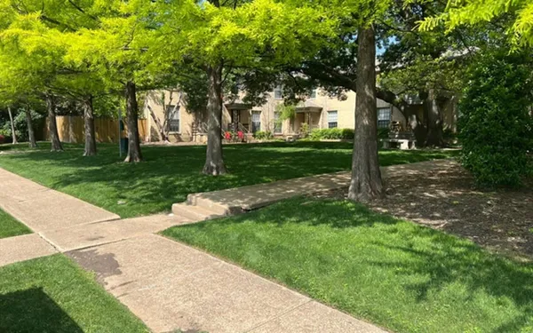a backyard of a house with lots of green space