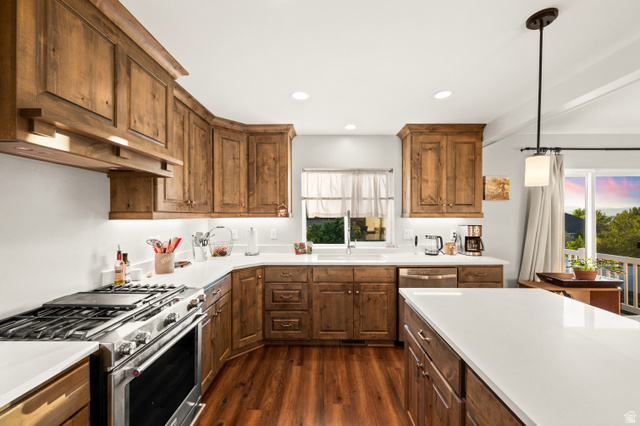 1145 North Christley Lane, Unit 48 Elk Ridge, UT 84651 - Photo 5 of 38 Expansive kitchen featuring wood-finish cabinetry, white countertops, built-in stainless steel appliances, wood-finish flooring, and recessed lighting