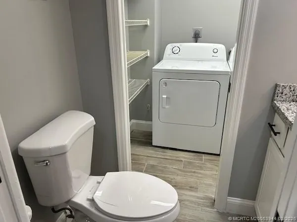 a bathroom with a toilet and a sink