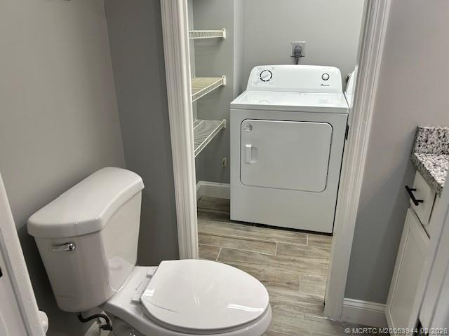 803 Southeast Central Parkway, Unit 5 Stuart, FL 34994 - Photo 13 of 19 a bathroom with a toilet and a sink