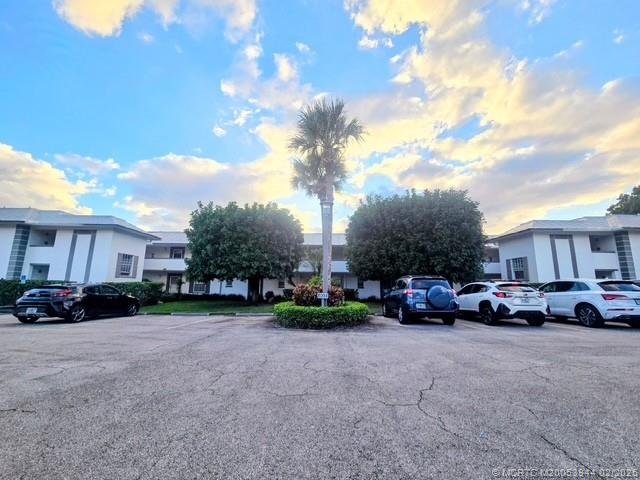 803 Southeast Central Parkway, Unit 5 Stuart, FL 34994 - Photo 16 of 19 a view of street with parked cars