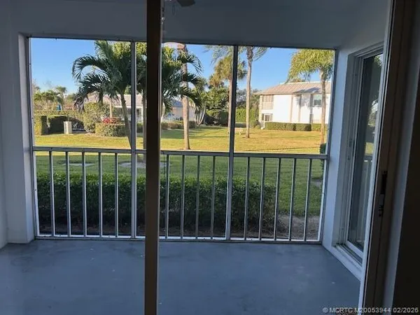 a view of a glass door and porch