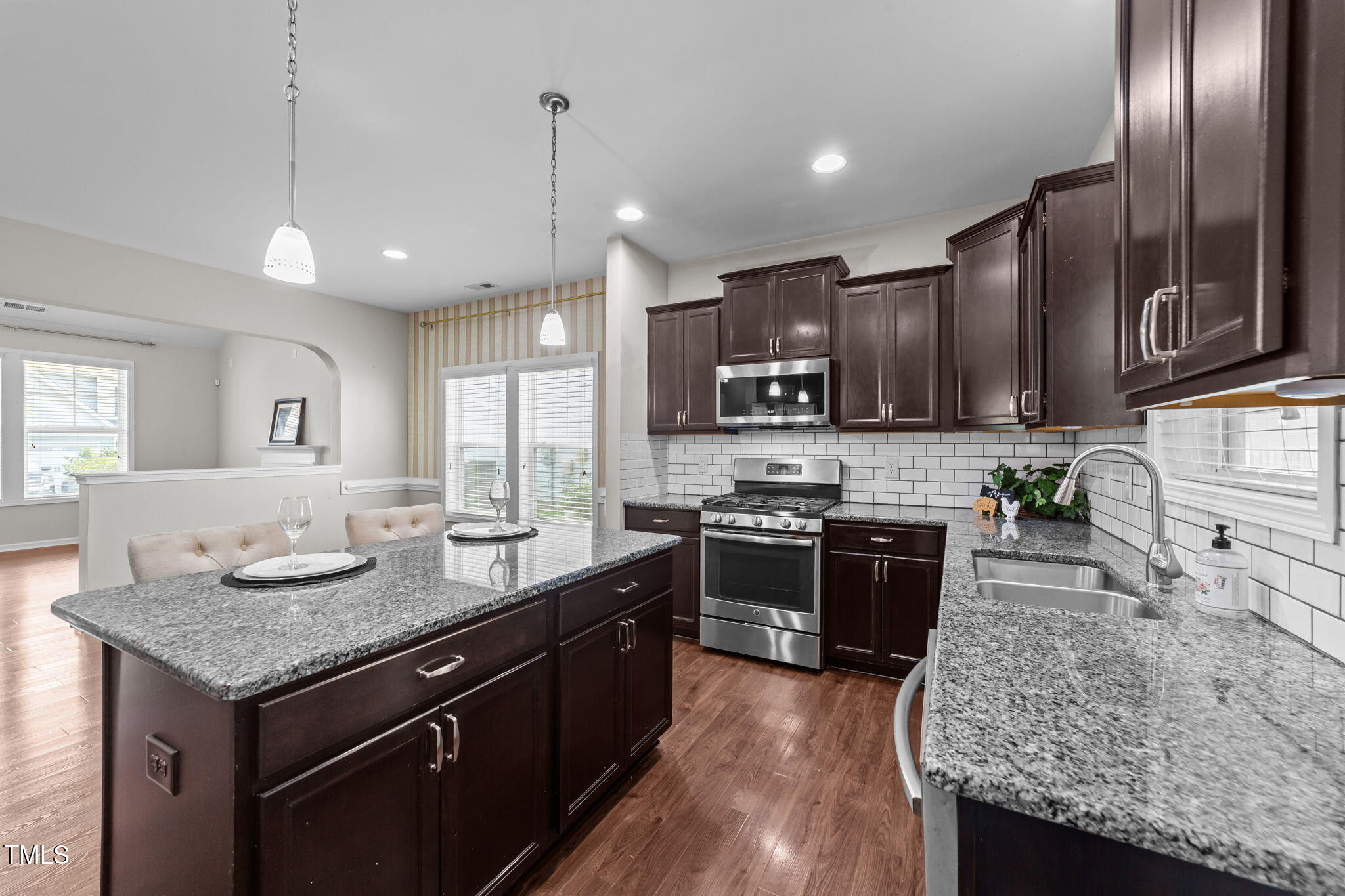 83 Mariners Point Way Garner, NC 27529 - Photo 2 of 49 a kitchen with stainless steel appliances granite countertop a sink stove and refrigerator