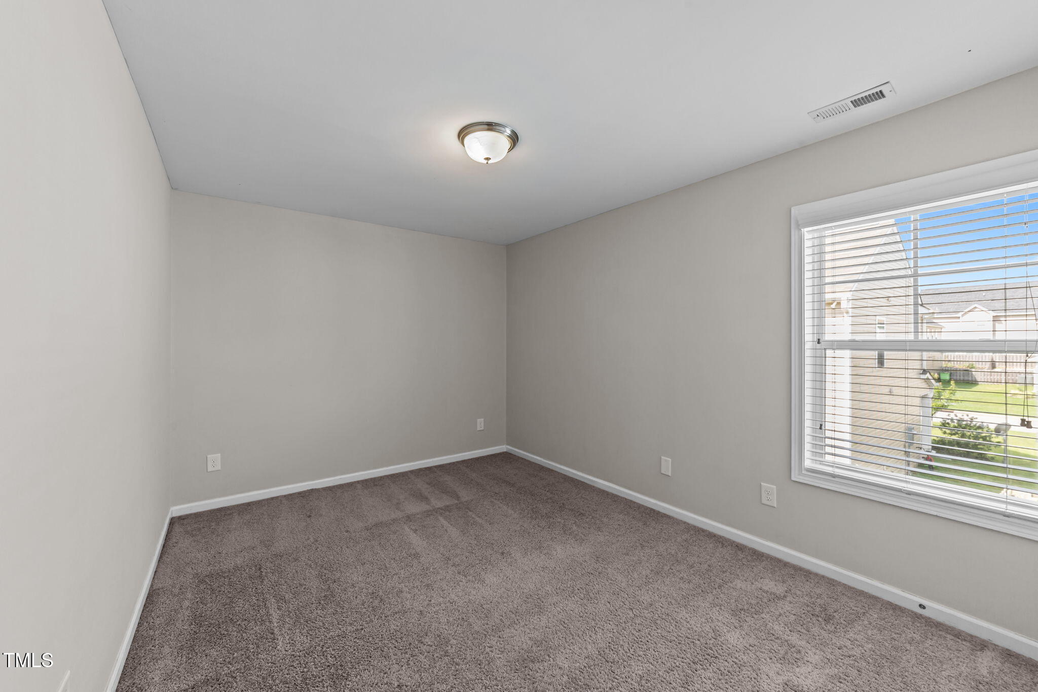 83 Mariners Point Way Garner, NC 27529 - Photo 21 of 49 an empty room with a window