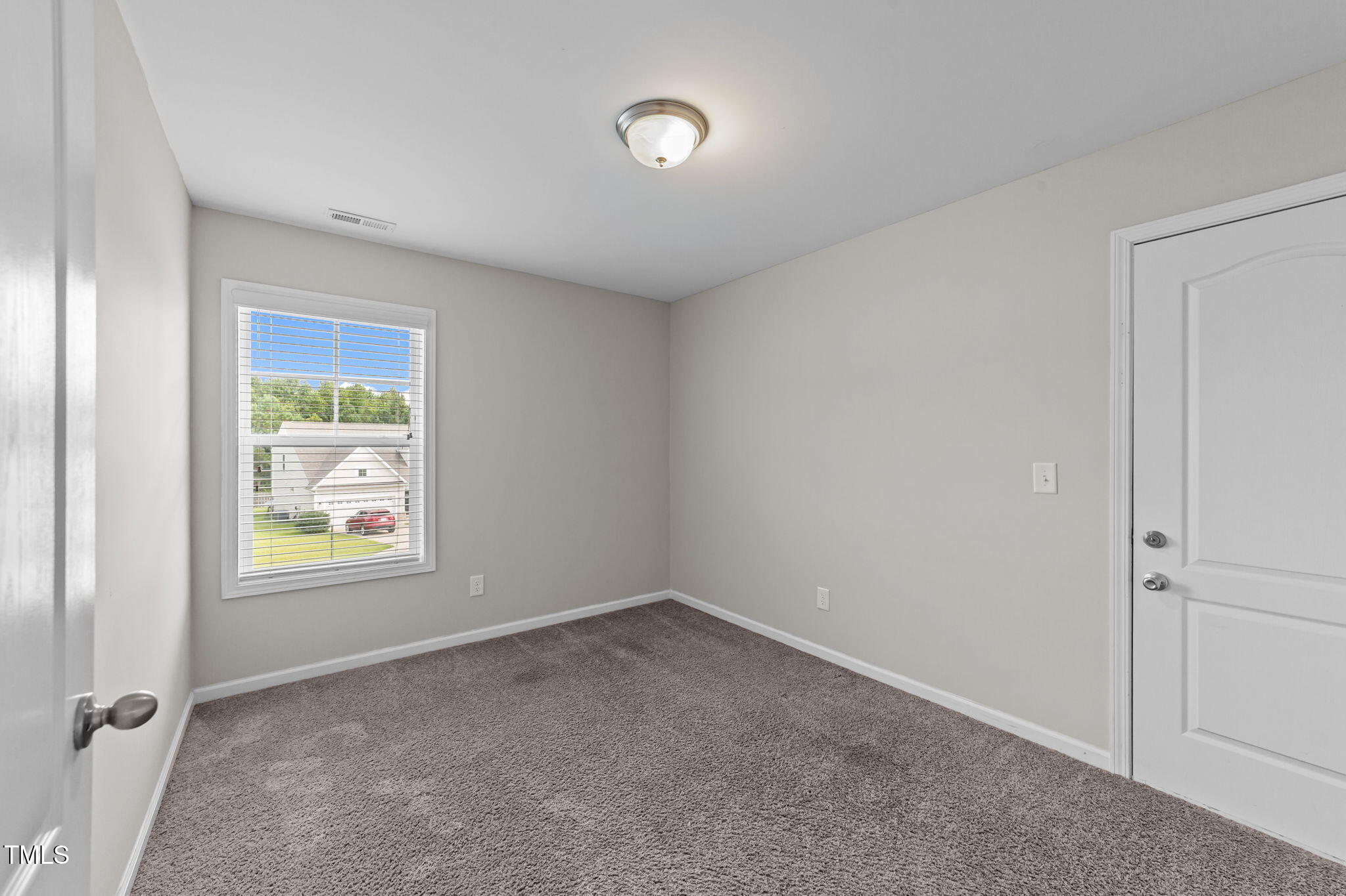 83 Mariners Point Way Garner, NC 27529 - Photo 23 of 49 an empty room with windows and closet