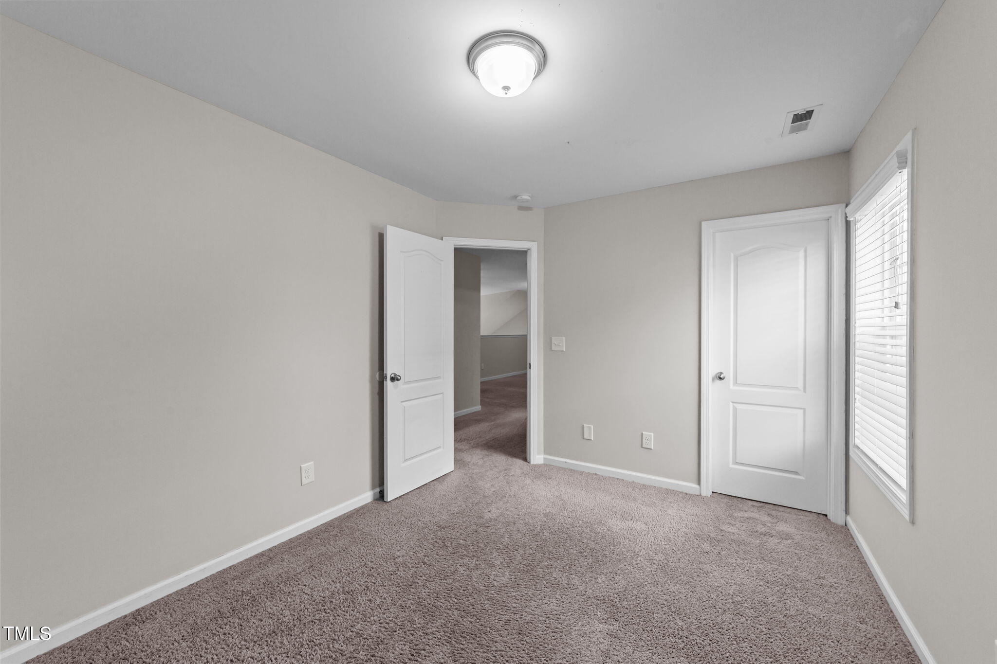 83 Mariners Point Way Garner, NC 27529 - Photo 24 of 49 a view of an empty room and a window