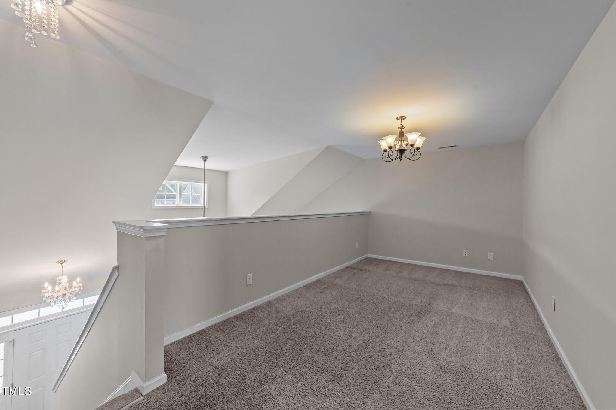83 Mariners Point Way Garner, NC 27529 - Photo 27 of 49 a view of an empty room with chandelier
