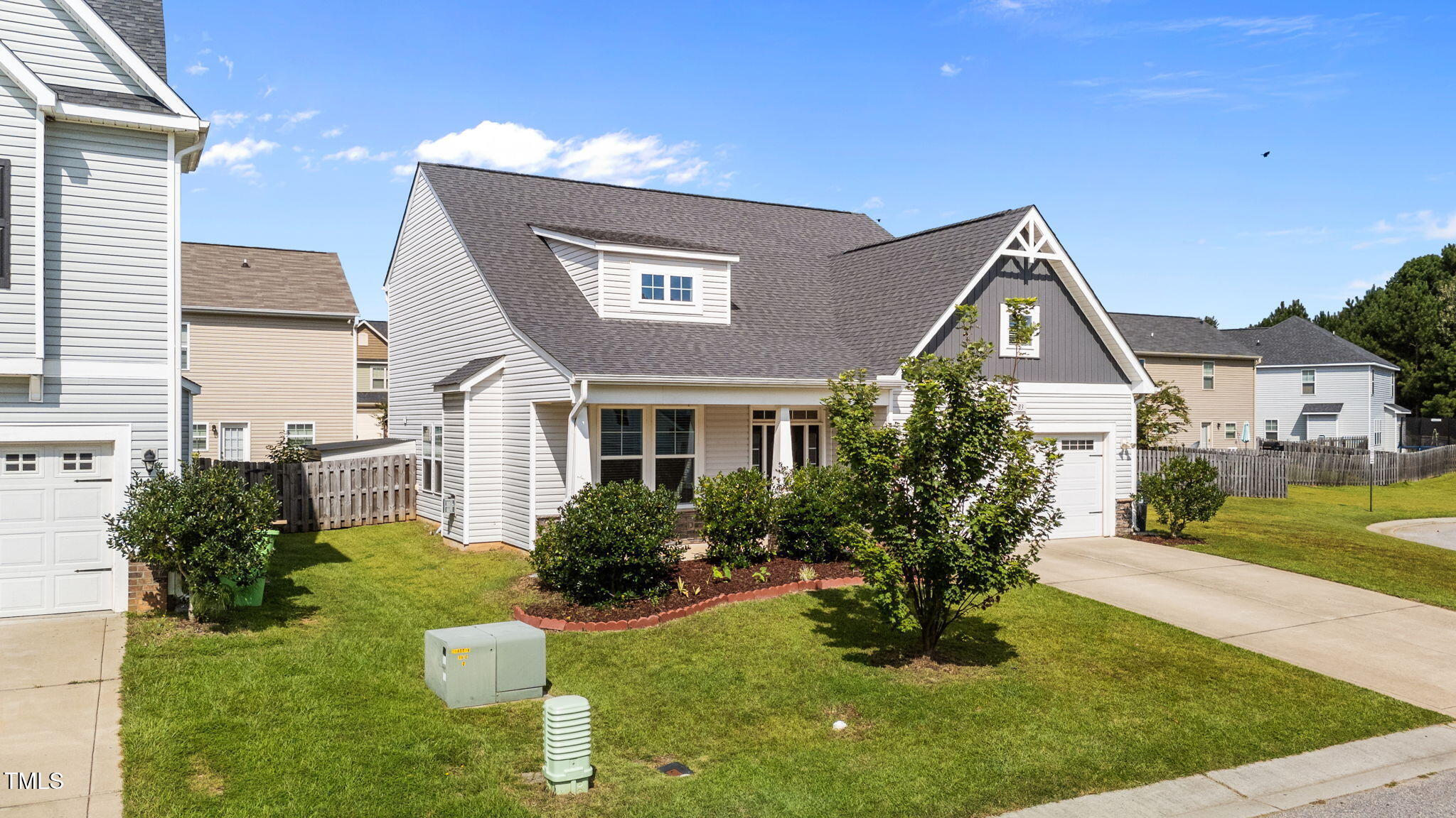 83 Mariners Point Way Garner, NC 27529 - Photo 33 of 49 a front view of a house with garden