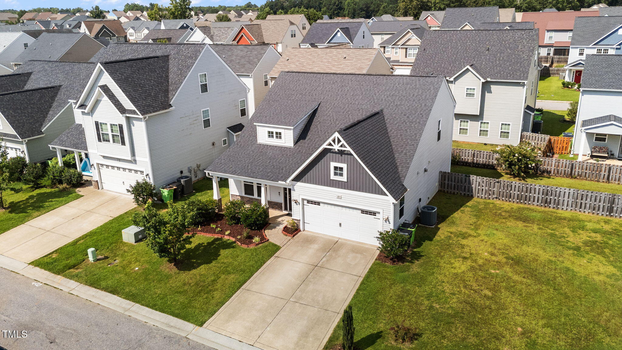 83 Mariners Point Way Garner, NC 27529 - Photo 36 of 49 an aerial view of a house with a garden and plants