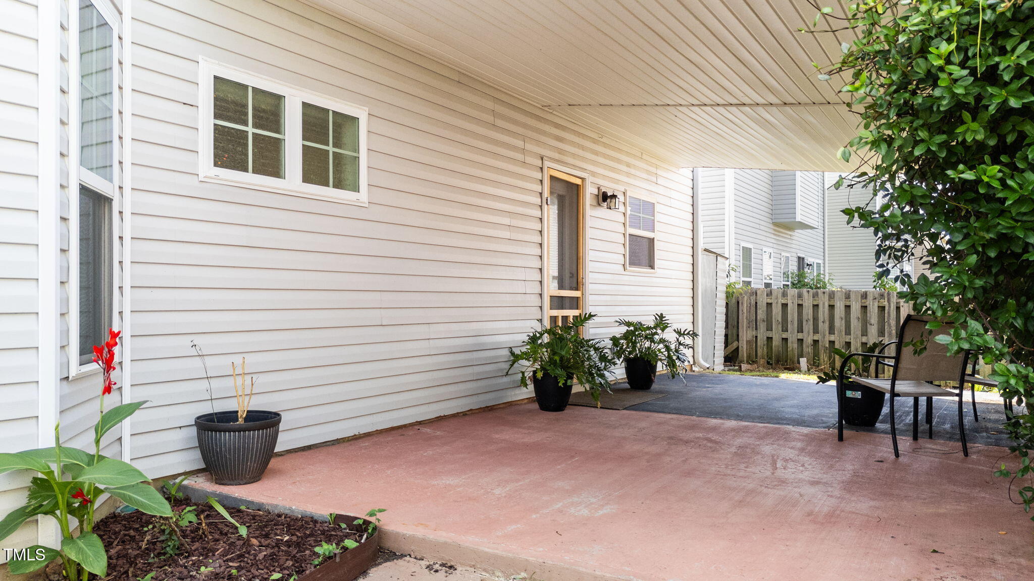 83 Mariners Point Way Garner, NC 27529 - Photo 40 of 49 a potted plant sitting in front of a house