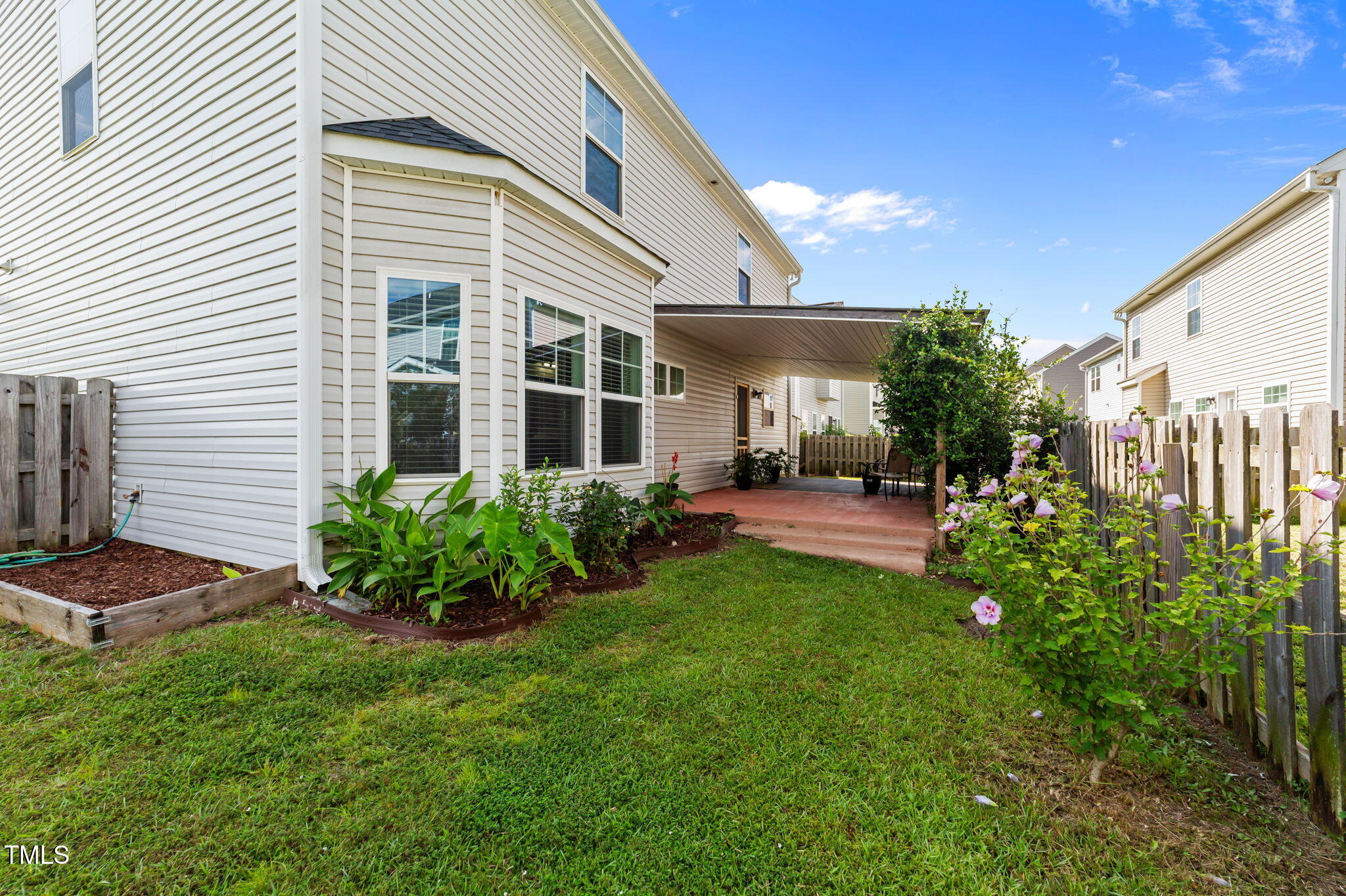 83 Mariners Point Way Garner, NC 27529 - Photo 41 of 49 a house view with a garden space