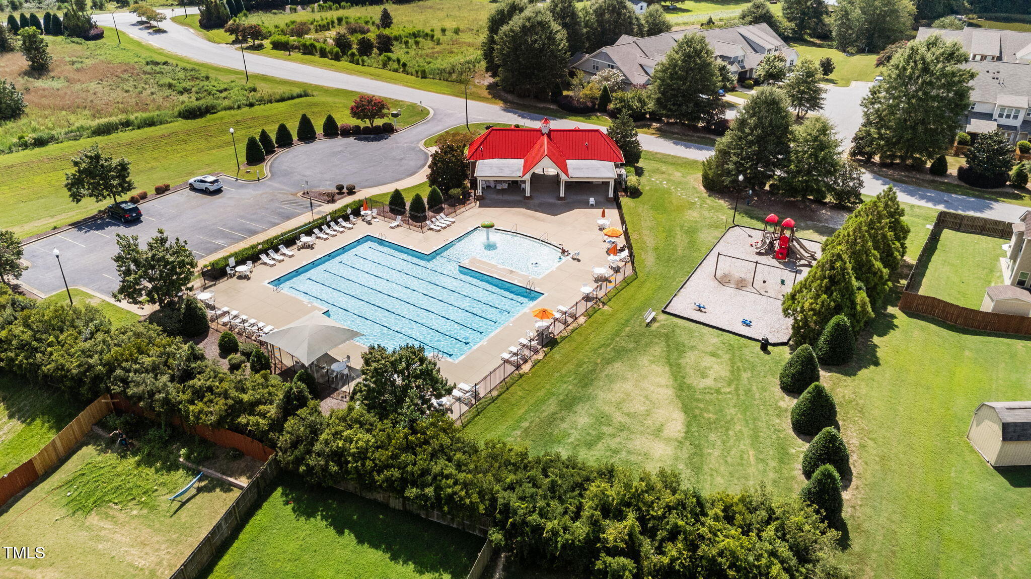 83 Mariners Point Way Garner, NC 27529 - Photo 47 of 49 an aerial view of a house with a garden and swimming pool