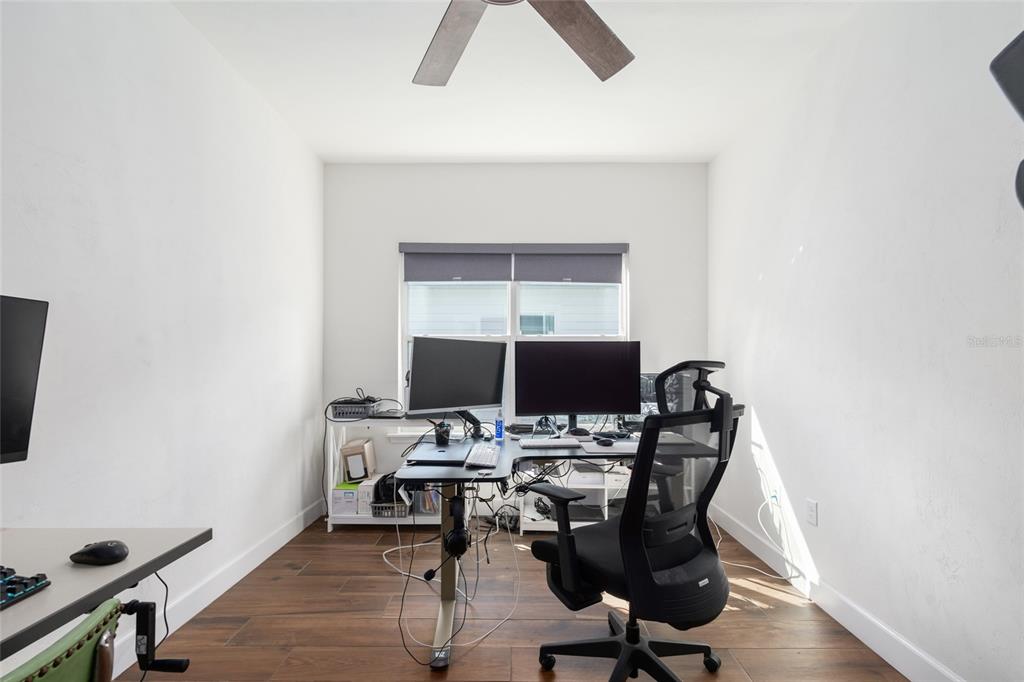6659 Southwest 12th Lane Gainesville, FL 32607 - Photo 17 of 37 a view of a workspace with furniture and a window
