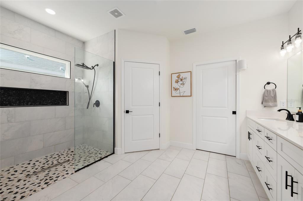 6659 Southwest 12th Lane Gainesville, FL 32607 - Photo 21 of 37 a bathroom with a sink a toilet and shower