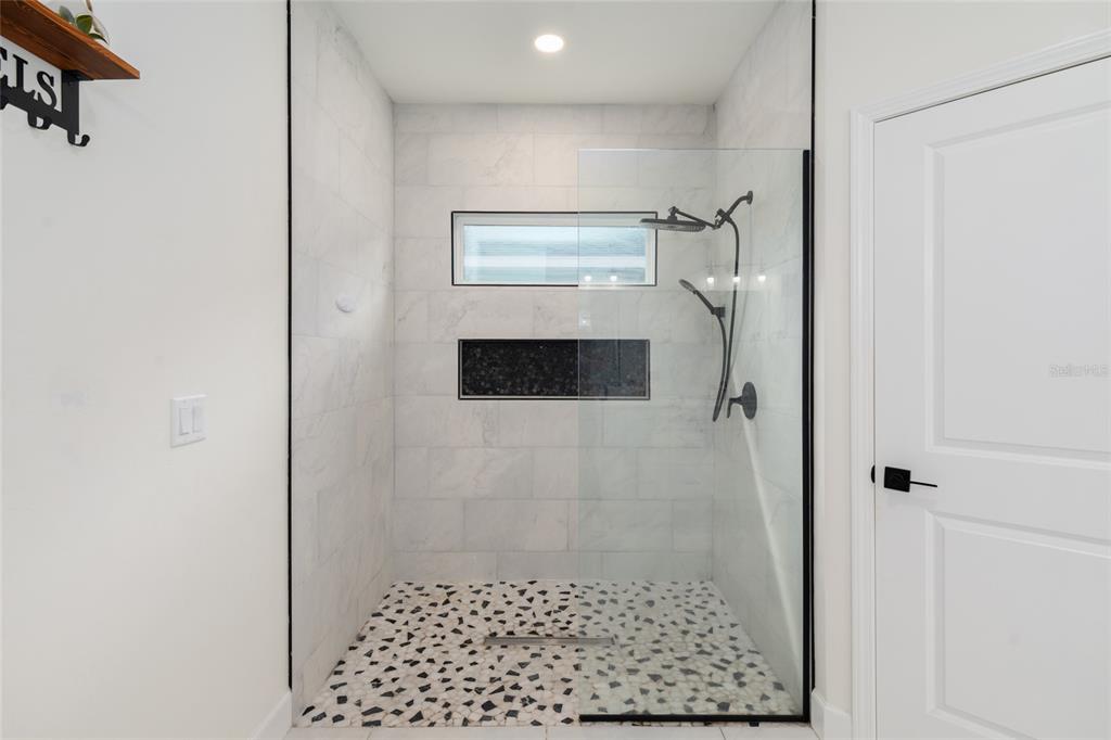 6659 Southwest 12th Lane Gainesville, FL 32607 - Photo 22 of 37 a bathroom with a shower