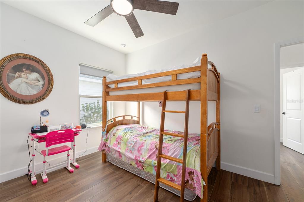 6659 Southwest 12th Lane Gainesville, FL 32607 - Photo 23 of 37 a bedroom with furniture and a window