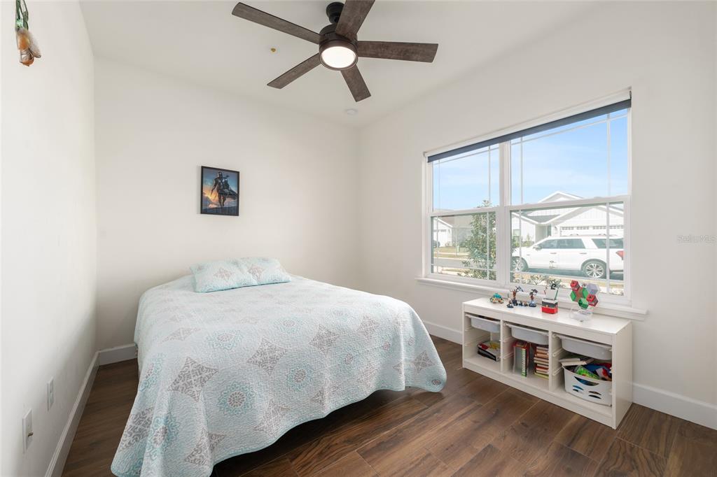 6659 Southwest 12th Lane Gainesville, FL 32607 - Photo 25 of 37 a bedroom with a bed and a window